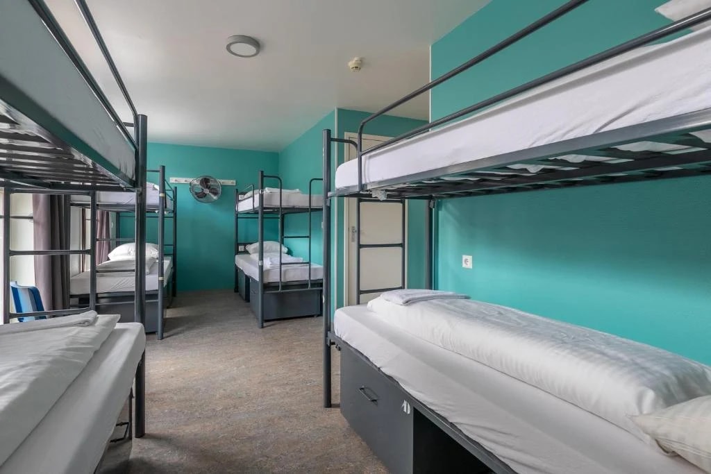A hostel dorm room with bunk beds